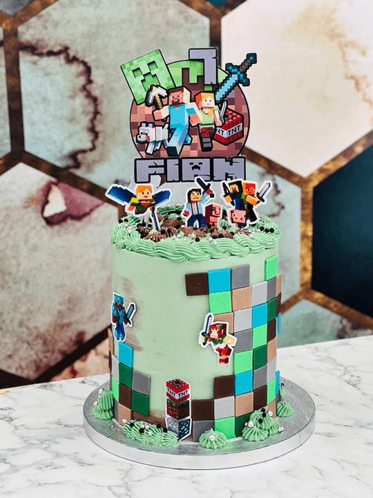 A Minecraft-themed celebration cake reading RJ Finn.